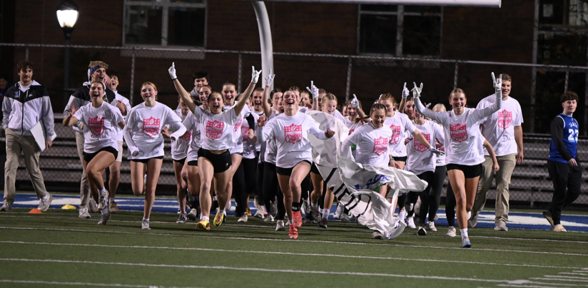 The juniors run out of the tunnel as they get excited to play.